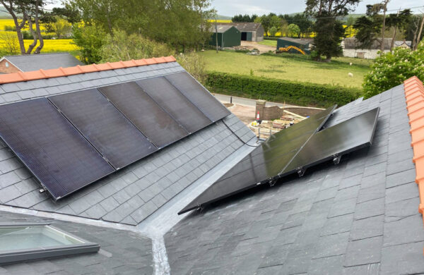 Solar panels fitted on a roof by island renewables