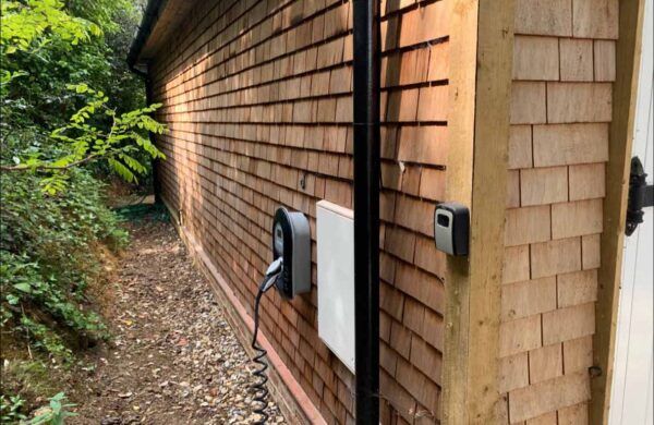 Myenergi Zappi ev charger on holiday home wall isle of wight