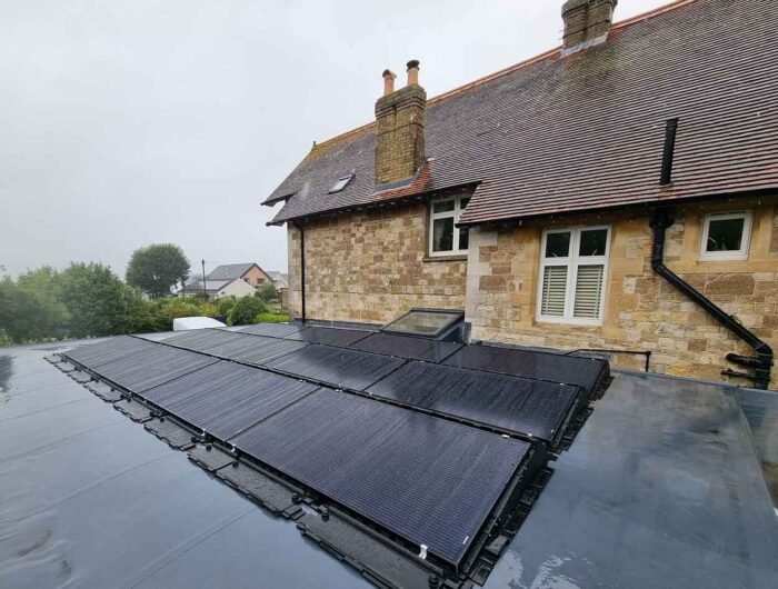 all black solar Panels fitted to a flat roof in cowes isle of wight