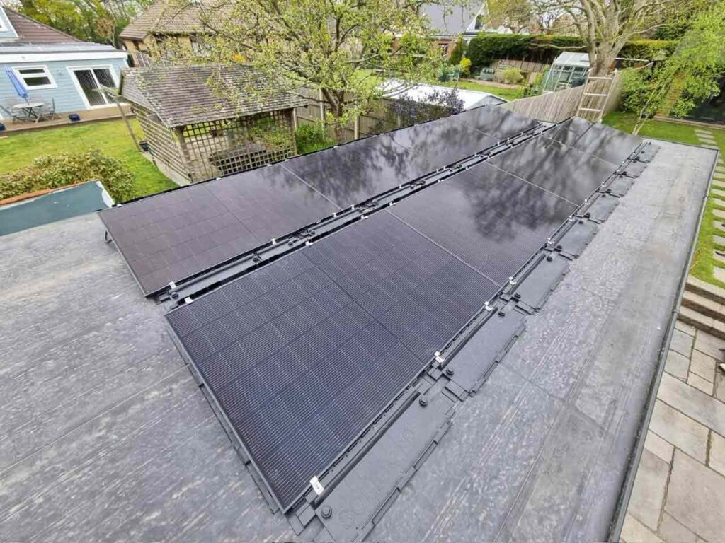 Solar panels fitted at an angle on a flat roof in ryde isle of wight