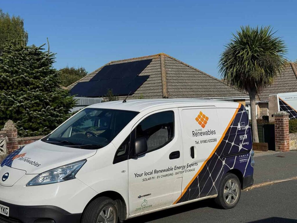 Island Renewables work van parked in front of property with a roof mounted solar installation on the isle of wight
